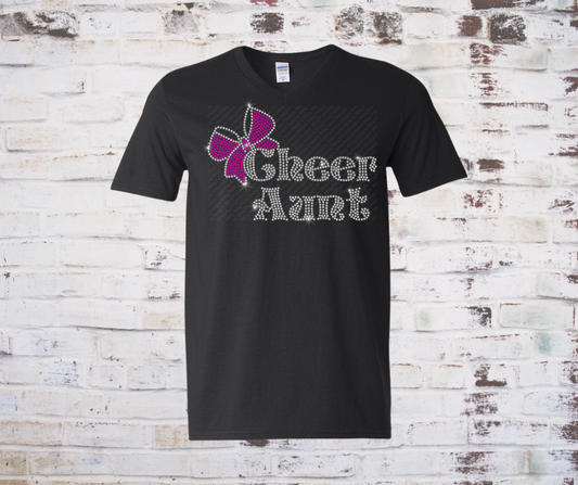 "Cheer Aunt" rhinestone tee with sparkling lettering and a rhinestone cheer bow design on the front, displayed on a soft, fitted shirt.