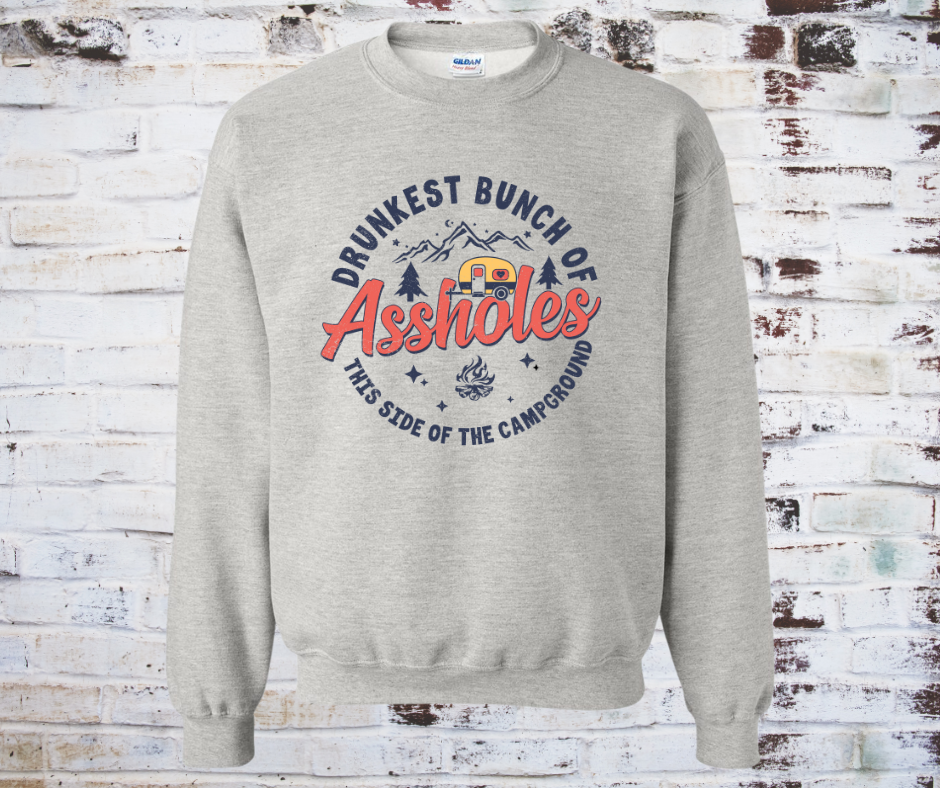A printed sweatshirt featuring the phrase 'Drunkest Bunch of Assholes This Side of the Campfire' in bold lettering, perfect for camping and bonfire gatherings.
