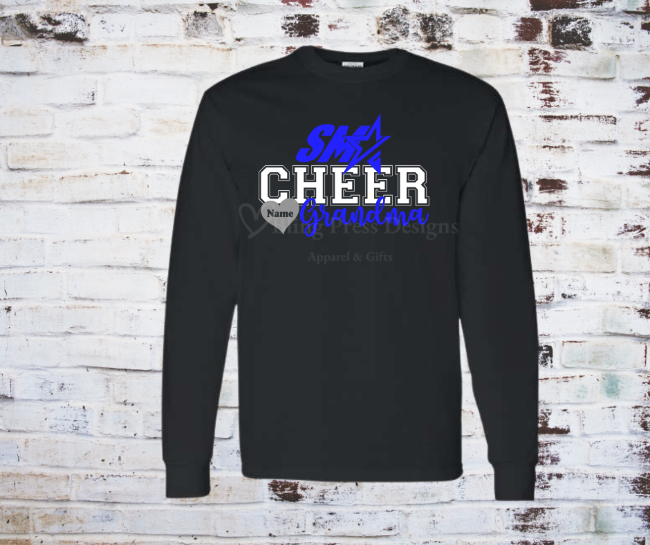 A black long sleeve "Cheer Grandma" tee with a bold glitter vinyl design, featuring sparkling lettering on soft, breathable fabric. Perfect for showing off cheerleading pride with a stylish, eye-catching touch.