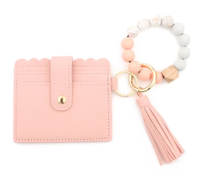 A peach stylish silicone beaded wristlet with soft, flexible beads on a durable elastic cord, designed for comfortable wear and hands-free key or accessory carrying.