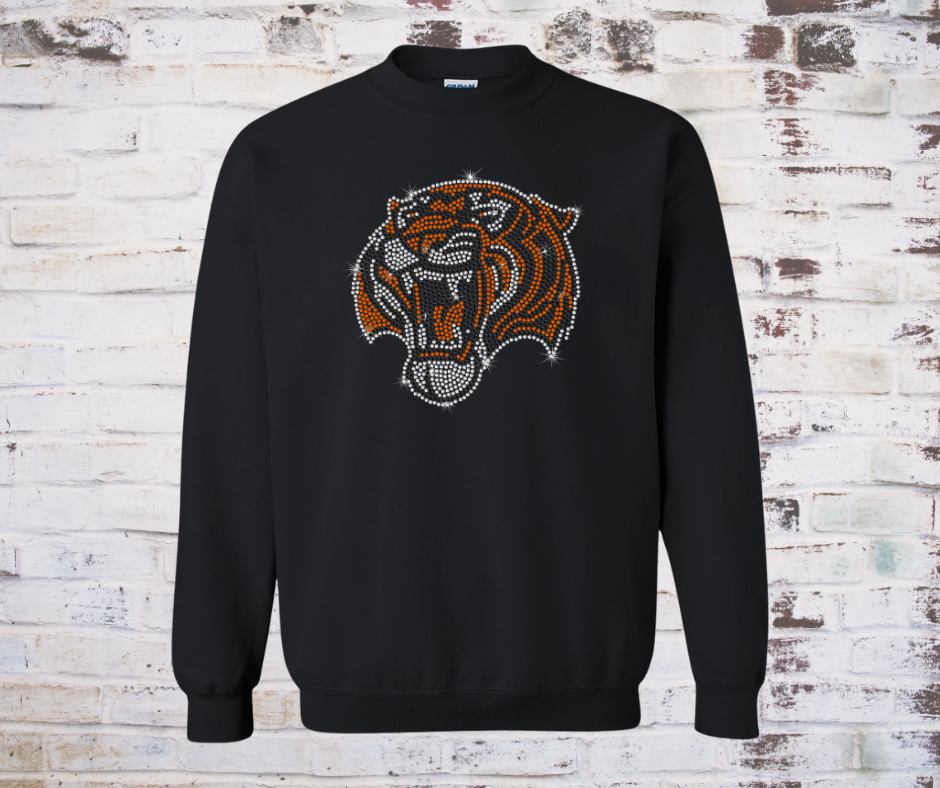 Black sweatshirt with a rhinestone tiger  on a wooden background