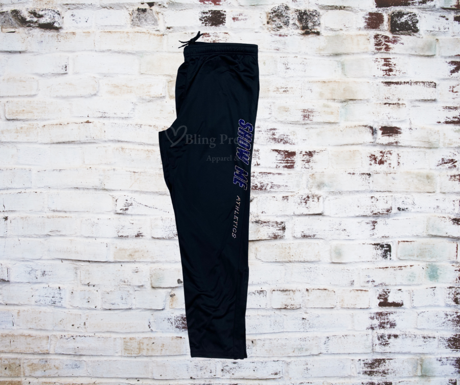 rhinestone-accent on sleek leg warm-up pants, showcasing the stylish embellishment