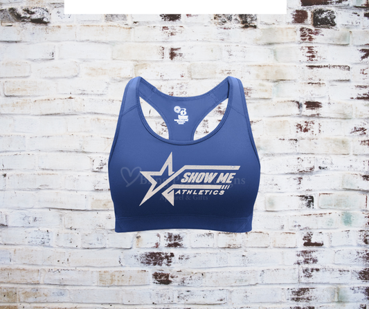 A royal blue Razorback sports bra with a glitter "Show Me Athletics" logo, crafted from moisture-wicking, stretchy fabric for comfort and support.