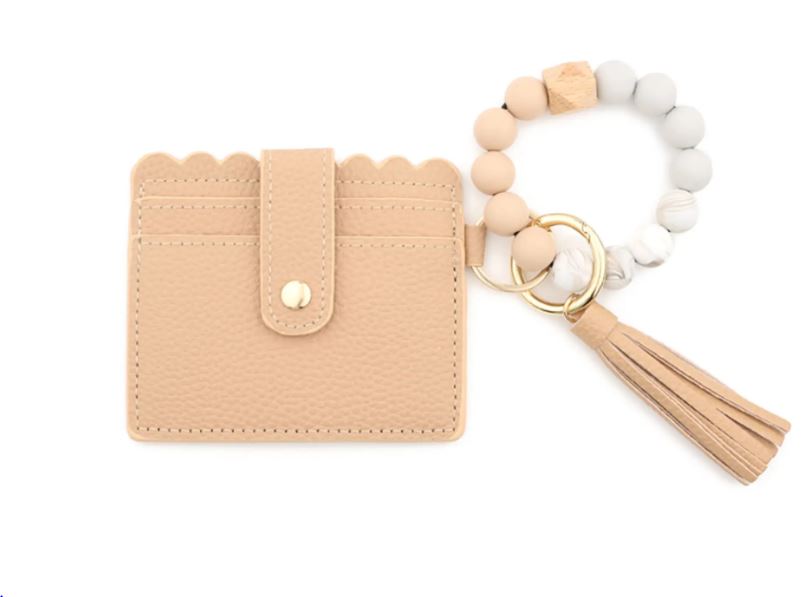 A tan stylish silicone beaded wristlet with soft, flexible beads on a durable elastic cord, designed for comfortable wear and hands-free key or accessory carrying.