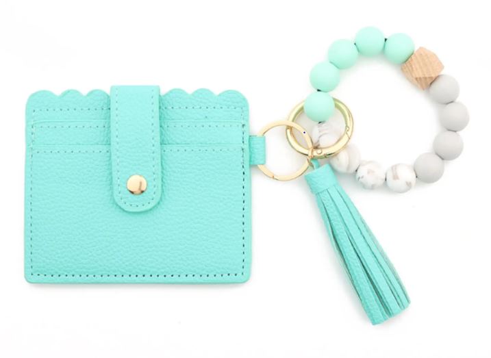 A teal stylish silicone beaded wristlet with soft, flexible beads on a durable elastic cord, designed for comfortable wear and hands-free key or accessory carrying.