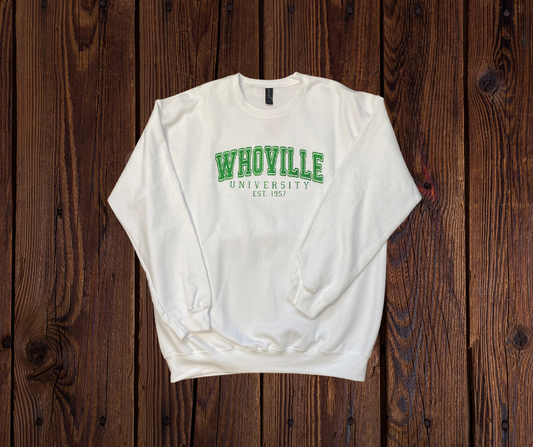 A **Glitter Vinyl Whooville University Sweatshirt**, featuring a playful **Whooville University** design in glitter vinyl. Made from soft, cozy fabric for warmth and comfort, perfect for adding holiday charm and sparkle to your wardrobe.