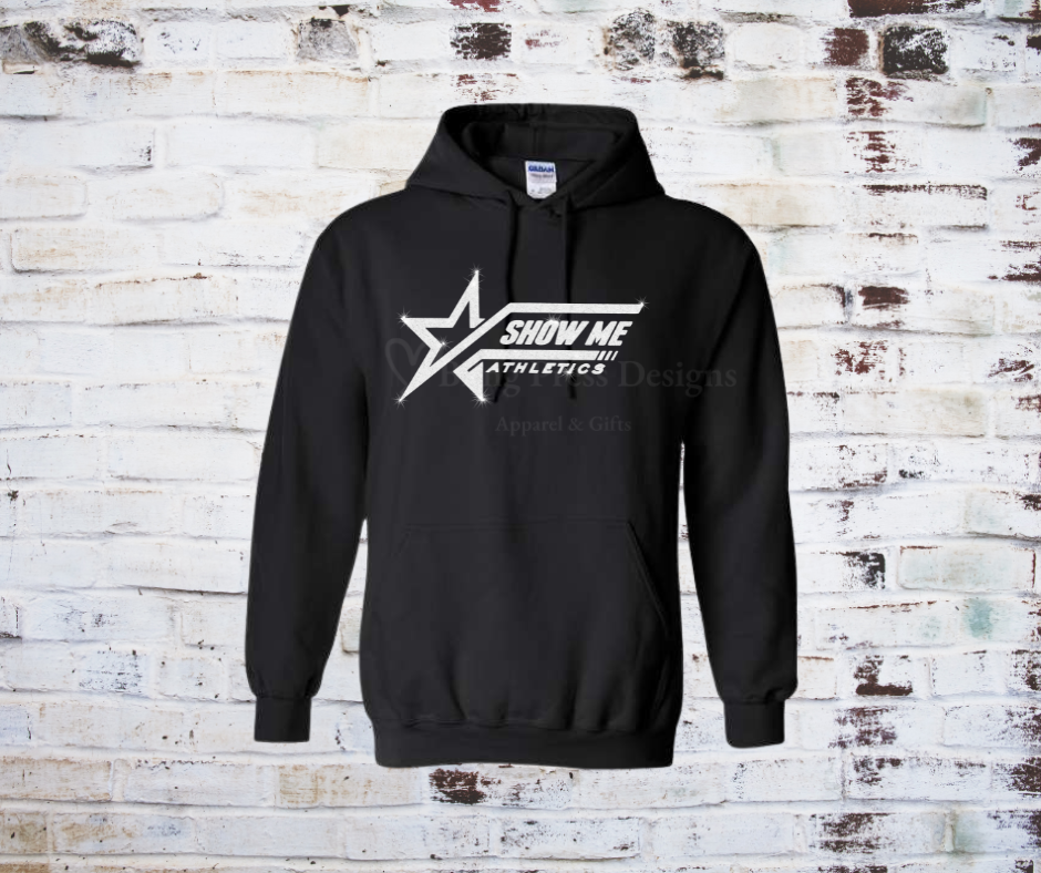 A black soft and cozy hoodie featuring a white glitter "Show Me" logo, designed with a relaxed fit, front pocket, and adjustable drawstring hood.