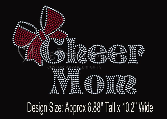 Close-up of a 'Cheer Mom' rhinestone design with a bow accent on a soft tee, featuring sparkling rhinestones that highlight the text."