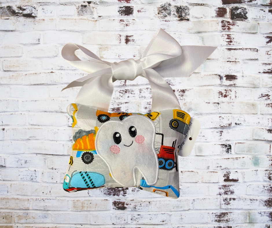 A **Handmade Fabric Tooth Fairy Pillow**, featuring a small pocket for placing lost teeth, crafted from soft, high-quality fabric with charming details. A functional and magical keepsake for children.