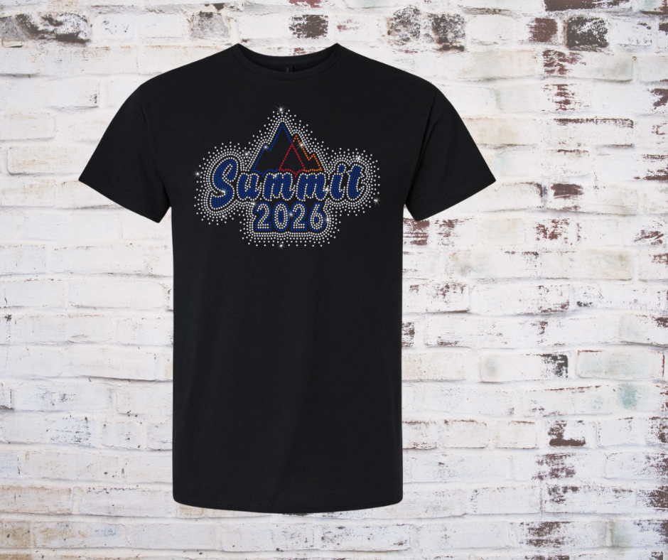 Black t-shirt with 'Summit 2026' Rhinestone design on a brick wall background
