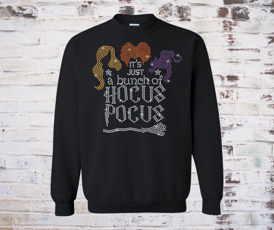  *Colorful rhinestone “Just a Bunch of Hocus Pocus” design on a cozy black sweatshirt, sparkling with festive Halloween bling.*

