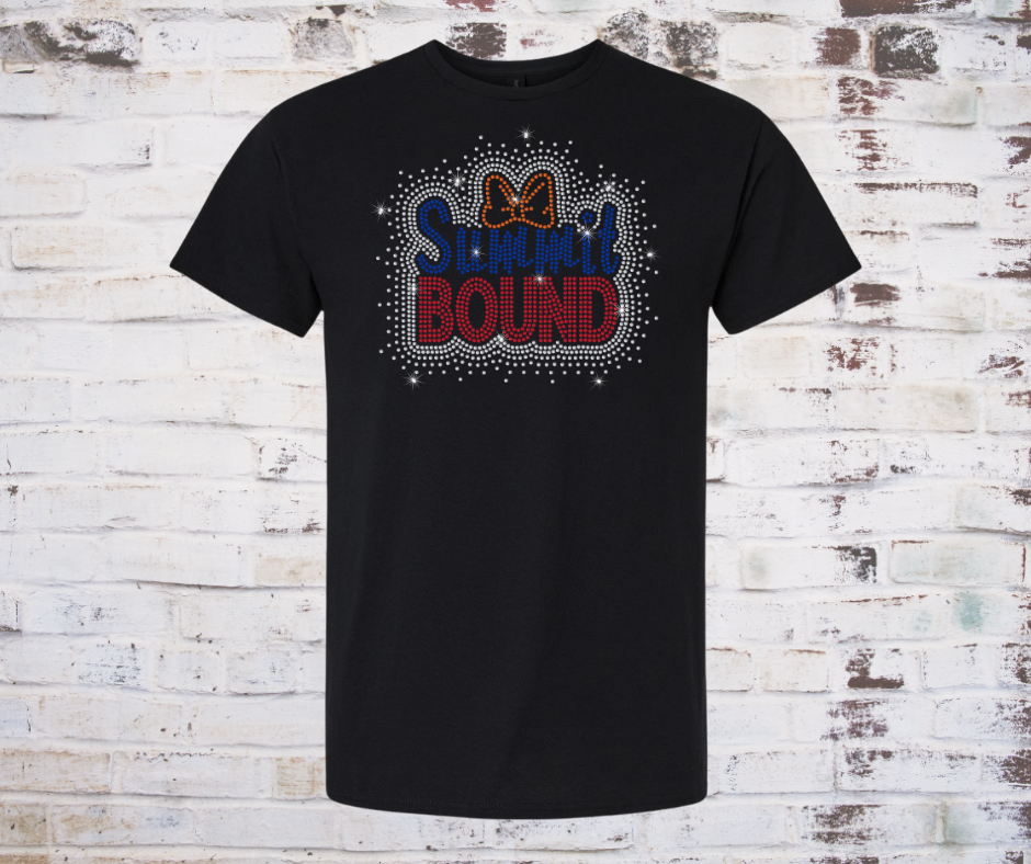 Black t-shirt with 'SUMMit BOUND' rhinestone text and bow design on a rustic wooden background