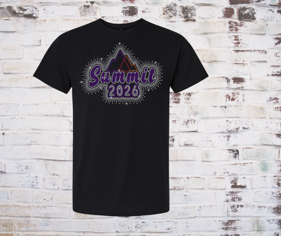 Black t-shirt with 'Summit 2026' Rhinestone design on a brick wall background