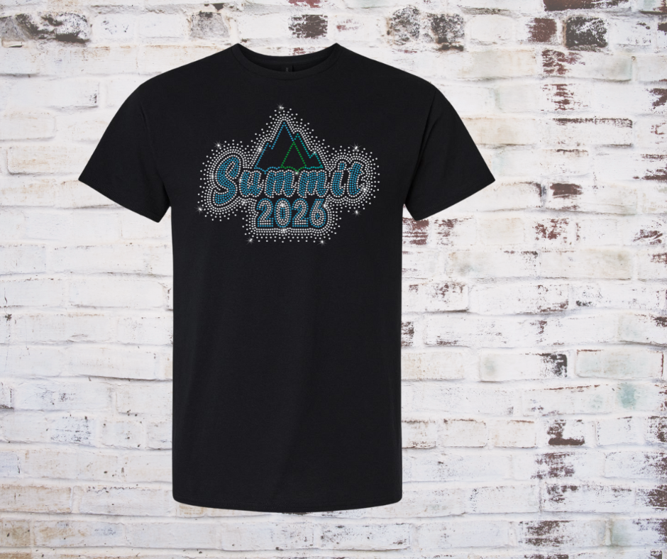 Black t-shirt with 'Summit 2026' Rhinestone design on a brick wall background