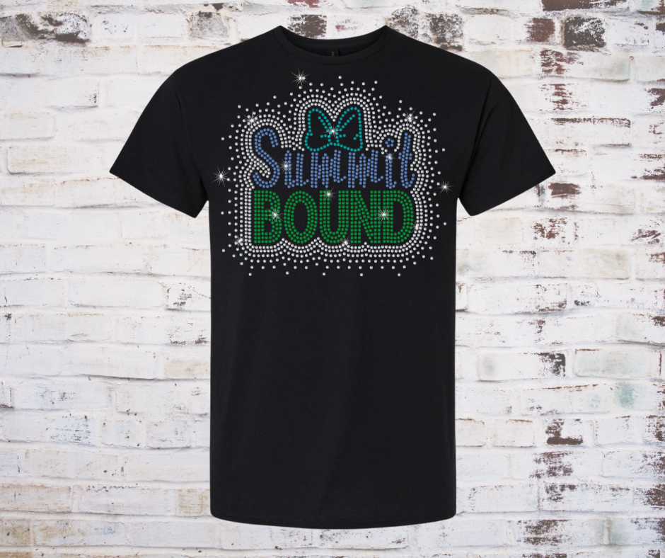 Black t-shirt with 'SUMMit BOUND' rhinestone text and bow design on a rustic wooden background