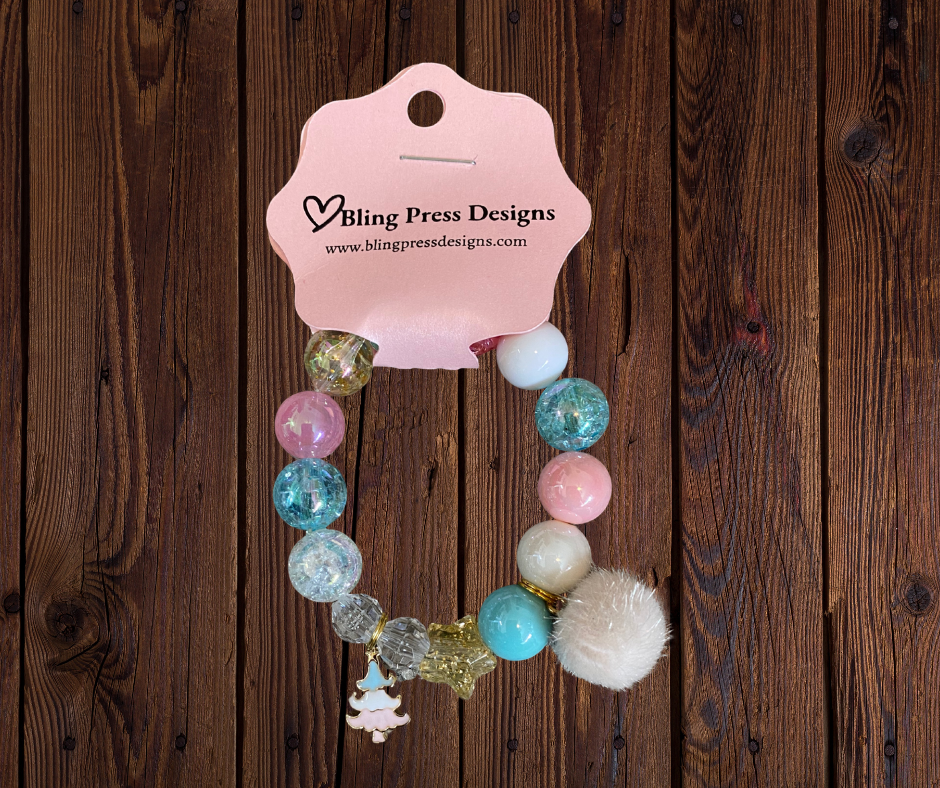 Colorful kids holiday stretch bracelets made with large bubble gum beads and festive charms, including Christmas-themed designs.
