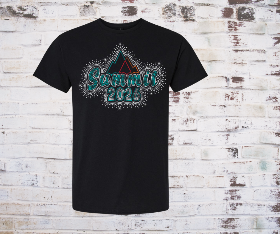 Black t-shirt with 'Summit 2026' Rhinestone design on a brick wall background