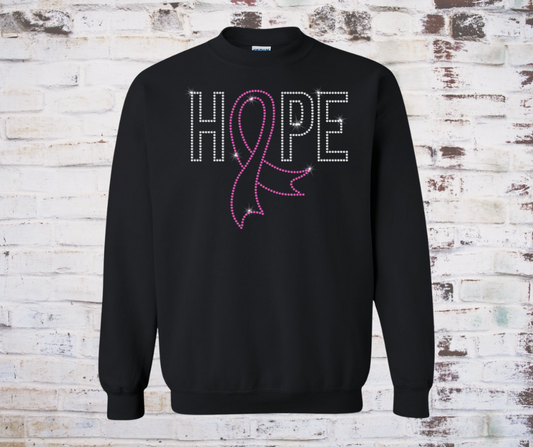 Black sweatshirt with a sparkling rhinestone HOPE design and a pink breast cancer awareness ribbon.
