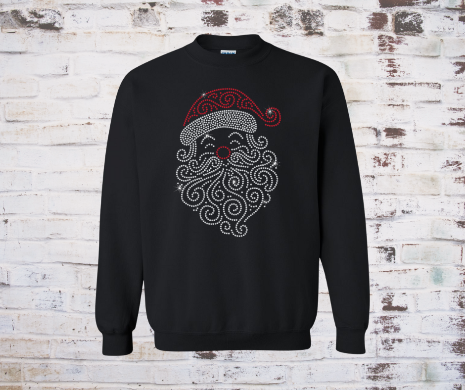 Black sweatshirt with Santa Claus design on a textured white brick wall background