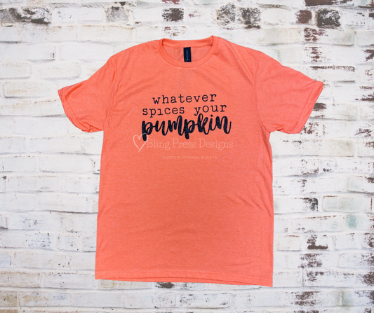 A **Whatever Spices Your Pumpkin Tee** featuring the playful phrase "Whatever Spices Your Pumpkin" in black glitter lettering. Made from soft, comfortable fabric, perfect for fall festivities or casual wear with a fun, seasonal twist.