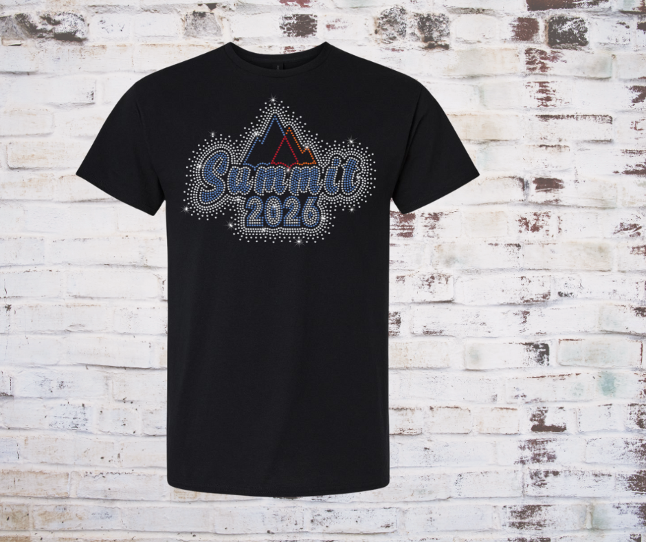 Black t-shirt with 'Summit 2026' Rhinestone design on a brick wall background