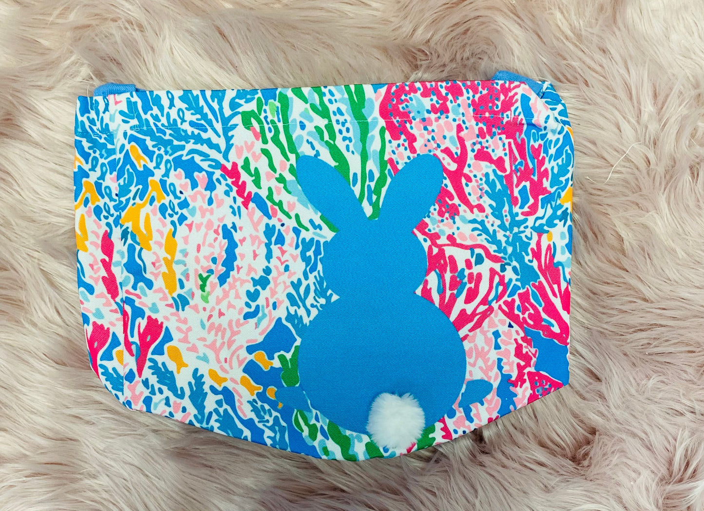 Blue Floral  personalized canvas Easter basket with glitter vinyl lettering, featuring a bunny silhouette with cotton tail, sturdy handle and a spacious design, perfect for Easter egg hunts and gifts. 