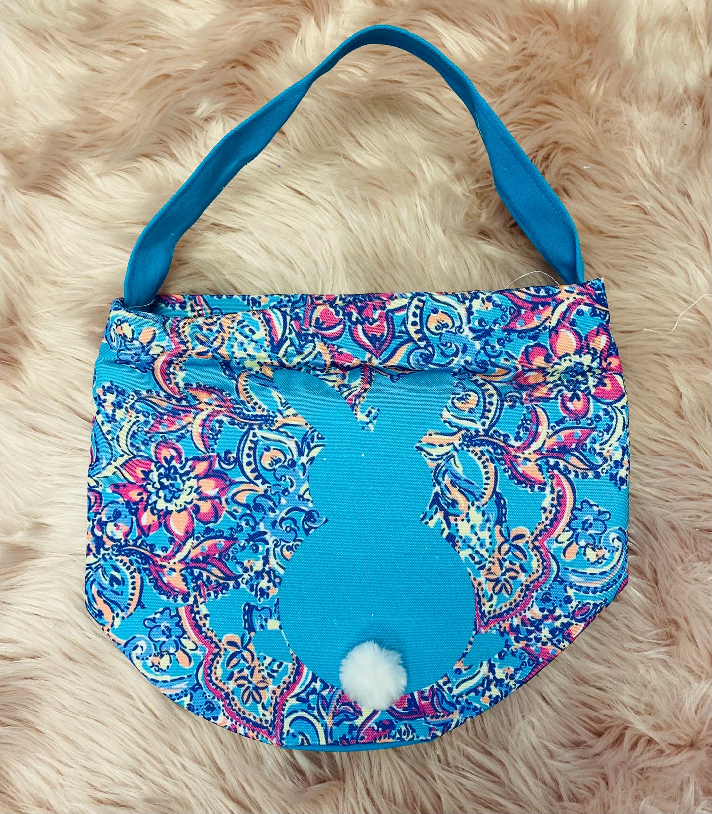 Blue Paisley  personalized canvas Easter basket with glitter vinyl lettering, featuring a bunny silhouette with cotton tail, sturdy handle and a spacious design, perfect for Easter egg hunts and gifts. 