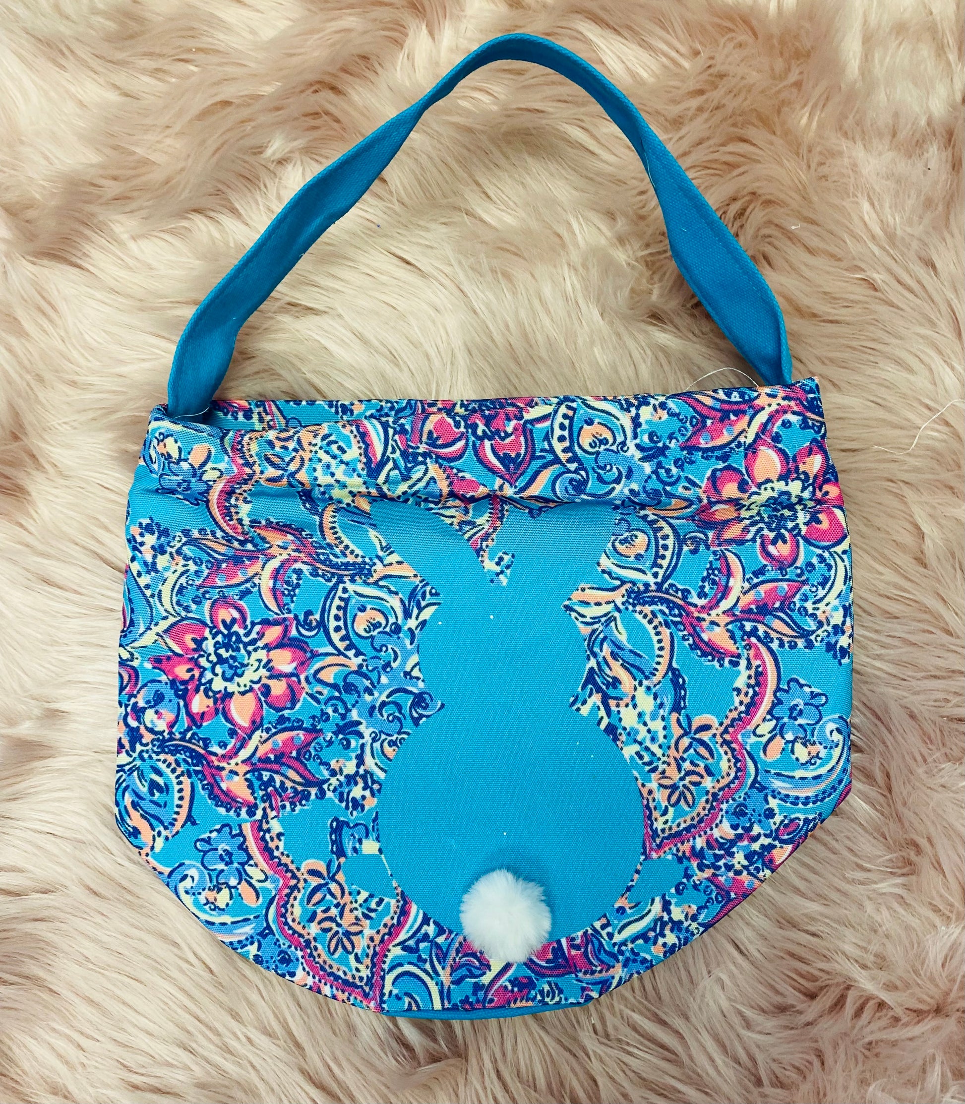 Blue Paisley  personalized canvas Easter basket with glitter vinyl lettering, featuring a bunny silhouette with cotton tail, sturdy handle and a spacious design, perfect for Easter egg hunts and gifts. 