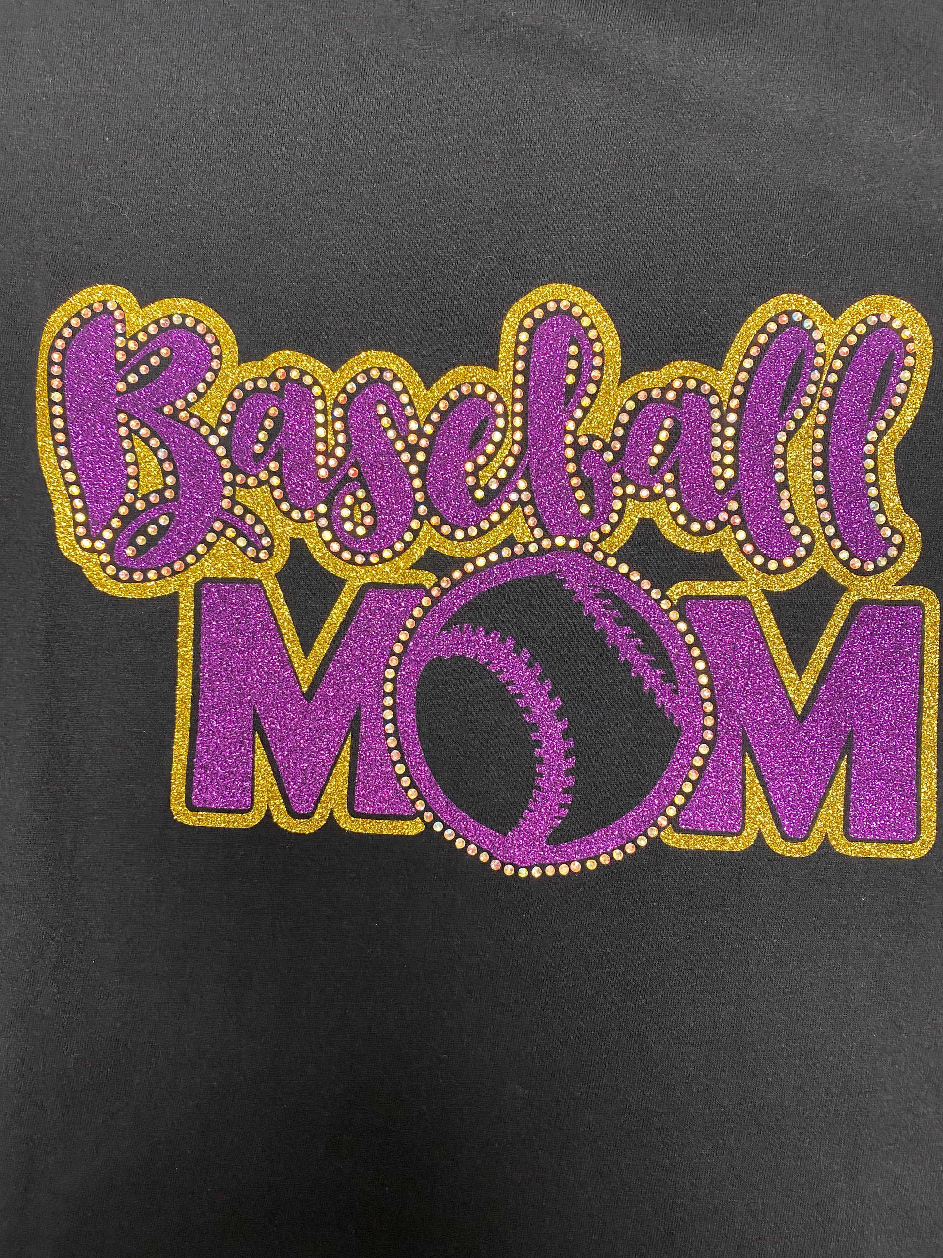 Close up of Baseball Mom tee with rhinestone accents and glitter vinyl design.