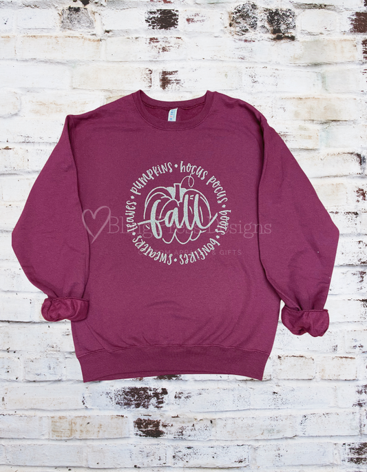 Maroon sweatshirt featuring falls favorite things.  Decorated with glold glitter vinyl for a bit of sparkle